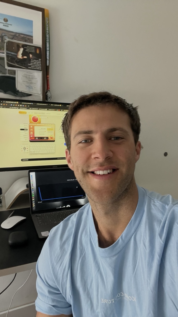 Justinas at his desk with Clacky open on the screen